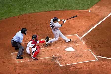 Darnell McDonald hitting a ball, with Kelly Shoppach catching.