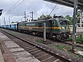 Wag-9 Locomotive at Vangaon Railway station, pulling a Automobile carrier rake.