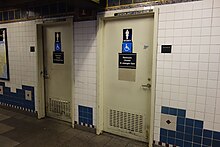 Two public bathroom doors with the wheelchair accessible icon and Braille signs