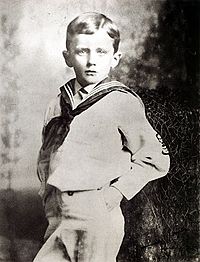 James Joyce at six in 1888 in sailor suit with hands in pocket, facing the camera