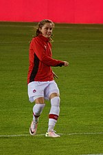 Photographie de la joueuse canadienne Jessie Fleming en train de faire une passage à l'échauffement avec l'équipe nationale du Canada.