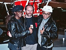 Fab Morvan (left) and Rob Pilatus (right) with NARAS president C. Michael Greene (center), February 1990