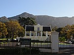 Tokai is situated almost due south of Groot Constantia up against the Steenberg mountain, on a portion of Simon van der Stel's former grazing lands. Tokai Road runs in a direct line from the main road to this stately old farm. The Manor House was built shortly after 1792 by Jan Andreas Rauch and is one of the most famous examples of Cape Dutch architecture. Type of site: Farmstead.