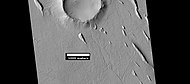 Yardangs near a crater, as seen by HiRISE under HiWish program Location is in the Amazonis quadrangle.