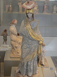 Greek statue of a woman with blue and gilt garment from Tanagra, 325–300 BC, gilt and painted terracotta, Antikensammlung Berlin, Berlin, Germany