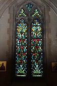 Art Nouveau stained glass in the nave with adjacent Georgian icons.