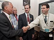 Charles Bolden congratulates Eric Finnegan as the spacecraft successfully inserted itself in Mercury's orbit.