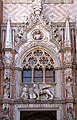 Shouldered arch above the main entrance of Doge's Palace in Venice. The vertical supports separate the segments of an ogee arch.
