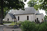 Almby kyrka från nordväst, juli 2022.