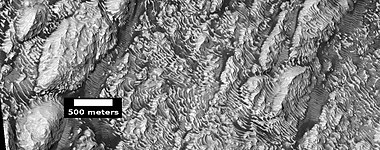 Layers in Danielson Crater, as seen by HiRISE under HiWish program. Scale is shown.