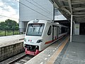 The EA203 series airport rail link train stopping at Manggarai Station heading to Soekarno-Hatta Airport Station via Duri-Batu Ceper, 2021