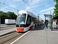 CAF Urbos AXL à une station.