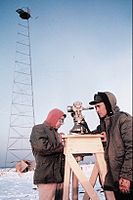United States Coast and Geodetic Survey technicians observing with a 0.2 arcsecond (≈ 0.001 mrad or 1 μrad) resolution Wild T3 theodolite mounted on an observing stand. Photo was taken during an Arctic field party (c. 1950).