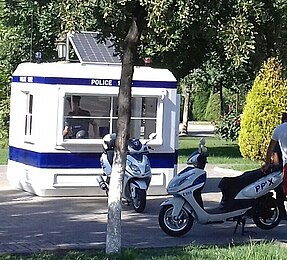 Uzbekistan Police motorcycles and Uzbekistan Police box with solar panel on the roof