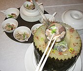 Another winter melon soup served from a carved melon bowl