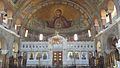 View of the marble Templon and the mural paintings depicting Panagia protecting the city of Patras