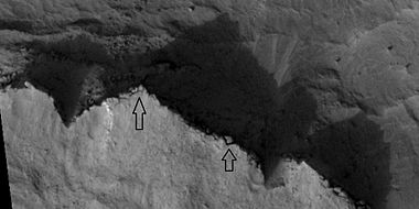 Cap rock breaking up into large blocks, as seen by HiRISE under HiWish program