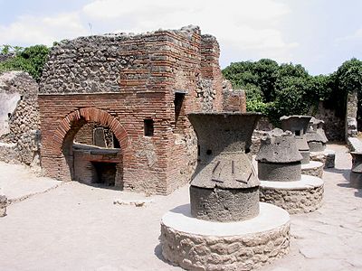 Millstones made of two elements of volcanic lava.[29] Bakery in Pompeii.