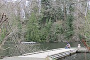 An angler sitting on a dock