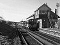 Train pulled by 121 Class locomotives entering Ballymote from Sligo in 1985 showing the now demolished signal box and goods depot