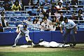 Image 2Rickey Henderson—the major leagues' all-time leader in runs and stolen bases—stealing third base in a 1988 game (from Baseball)