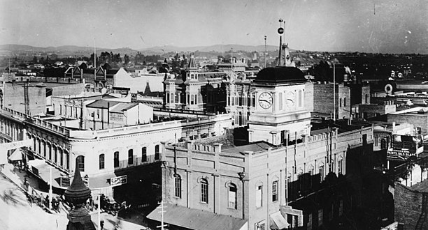 View from Spring St. of Clocktower Courthouse (r), southside of Temple Block (l), United States Hotel (back)