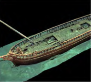 An overhead view of the forward two-thirds of a shipwreck