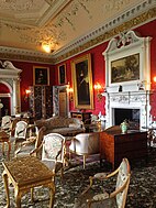 The Drawing Room. The furniture includes Louis XVI gilt chairs and settees by Chipchase with embroidered covers by the 3rd Duchess and her family.