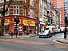 Denmark Street at its junction with Charing Cross Road, looking at Chris Bryant's Musical Instruments