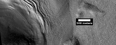 Close view of lobate debris apron around mesa, as seen by HiRISE under HiWish program. Brain terrain is visible.