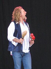 Robert Plant playing two pairs of maracas