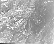 A top-down, black-and-white photograph of Cheyenne Mountain.