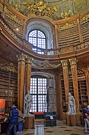 Stylized Baroque Corinthian columns in the Austrian National Library, Hofburg, Vienna, Austria, designed by Johann Bernhard Fischer von Erlach in c.1716–1720, built in 1723–1726[21]