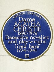 Colour photograph of a wall plaque stating Christie "lived here 1934–1941"