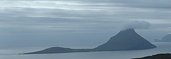 Koltur as seen from Streymoy, with the mountain of Kolturshamar centre right