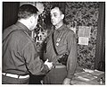 Major General Leland S. Hobbs presents the Legion Of Merit to Brigadier General James M. Lewis, commander of the 30th Division Artillery, for his meritorious service from July 28 to October 13, 1944.