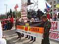 Anti-government far-right Odesskaya Druzhina militants holding a banner on the 20 April, with the neo-nazi Kolovrat symbol visible on their uniforms