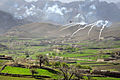 An AH-64 Apache helicopter shoots flares over a valley to support members of the 8th Commando Kandak and coalition special operations forces during a firefight near Nawa Garay village, Kajran district, Daykundi Province, Afghanistan.