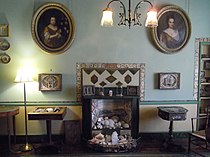 Display of shells in an ornate fireplace