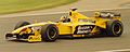Damon Hill driving the Jordan 199 at the 1999 British Grand Prix with "Buzzing Hornets" livery.