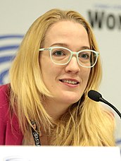 A smiling Emily Carmichael at a 2018 event