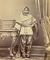 Sindhi girl from Karachi, Sind, in Sindhi ghagho like cholo and narrow suthan. c. 1870.