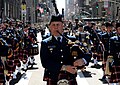 An auxiliarist piper in highland dress uniform performing as part of the Coast Guard Pipe Band. The Coast Guard Pipe Band is composed of active duty, reservists and retired members of the U.S. Coast Guard and members of the U.S Coast Guard Auxiliary.