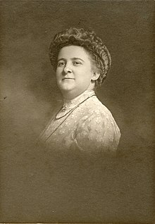 Portrait of a white woman with a bouffant hairdo