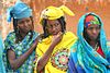 Two Fula women in colorful clothing