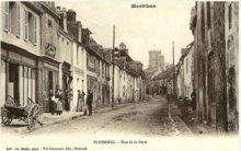 Carte postale ancienne représentant la rue de la gare vers 1900