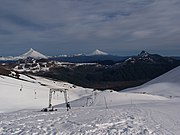 Ski slopes on the Antillanca Group, in the background: Puntiagudo and Osorno.