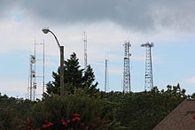 Several tall antennas in a small area