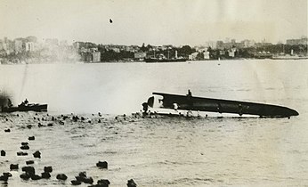 The top-heavily loaded Rodney capsizes and sinks in 1938 with the loss of nineteen lives.