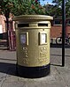 Rower Tom James's golden post box in Wrexham